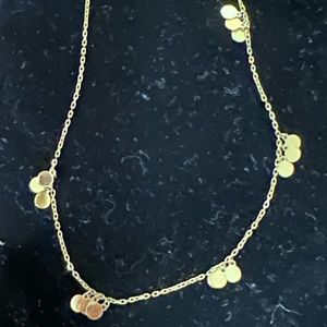 14k yellow gold necklace with 5 stations of mirroring gold discs